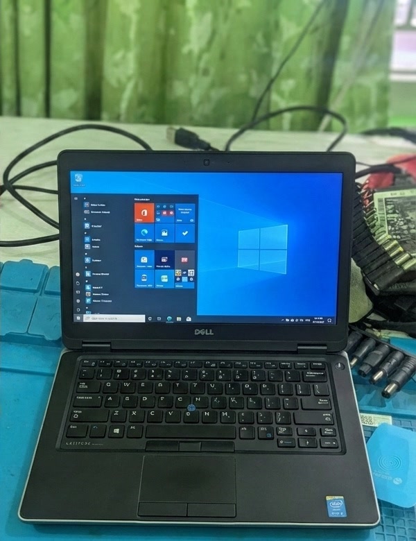 A repaired Dell laptop with a working display